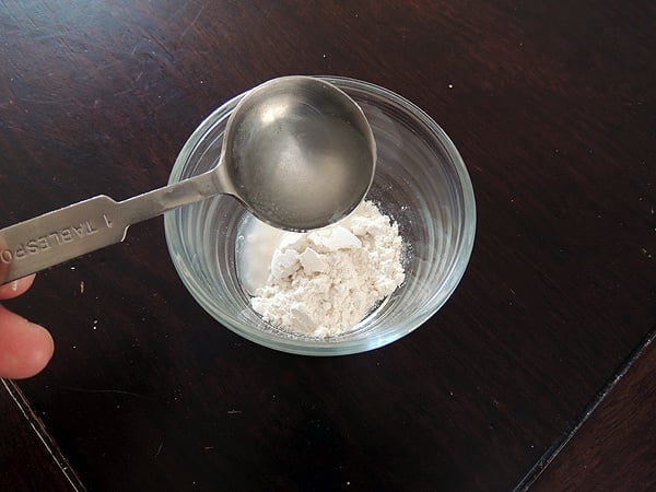 Adding water to the flour.