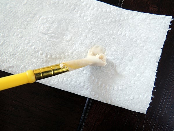Adding paste to the toilet paper. 