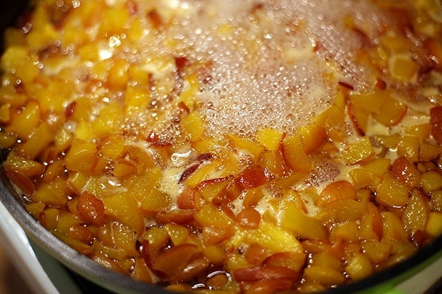 bringing the peaches to a boil