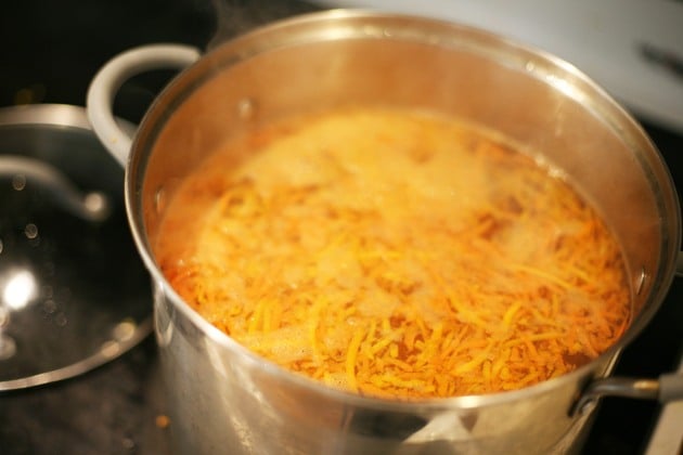 Blanching shredded carrots. 