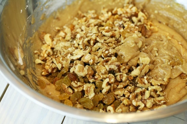 Adding walnuts to the batter. 