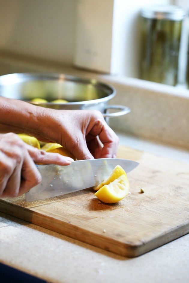 Cutting the lemon peels.