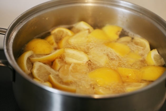 Boiling the lemon peel.