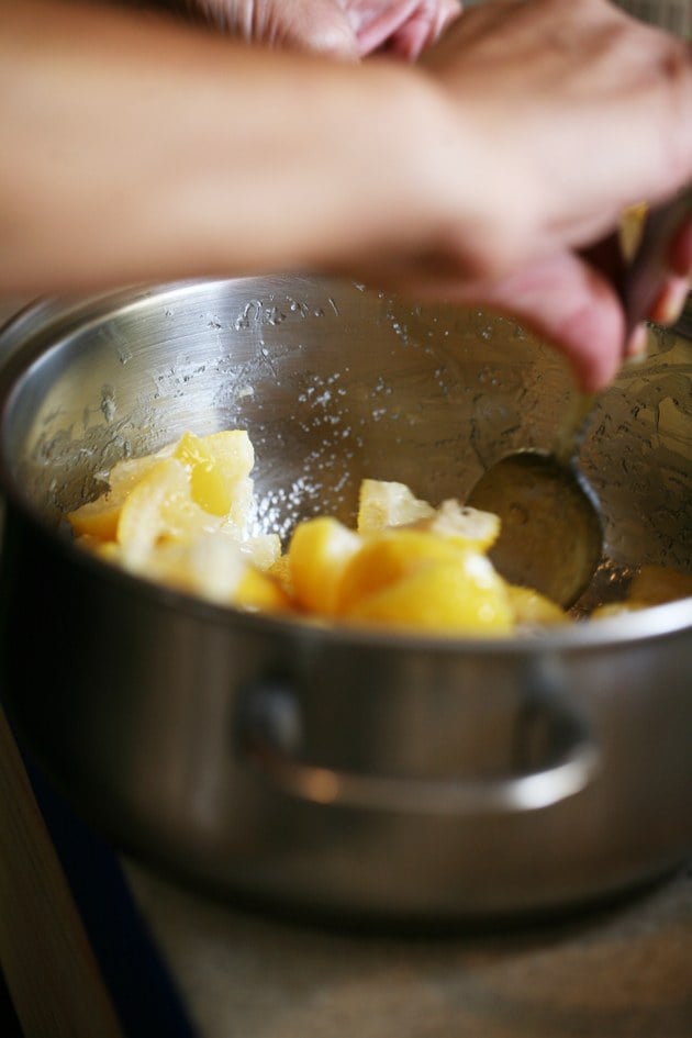 Mixing the peels with the oil and salt. 