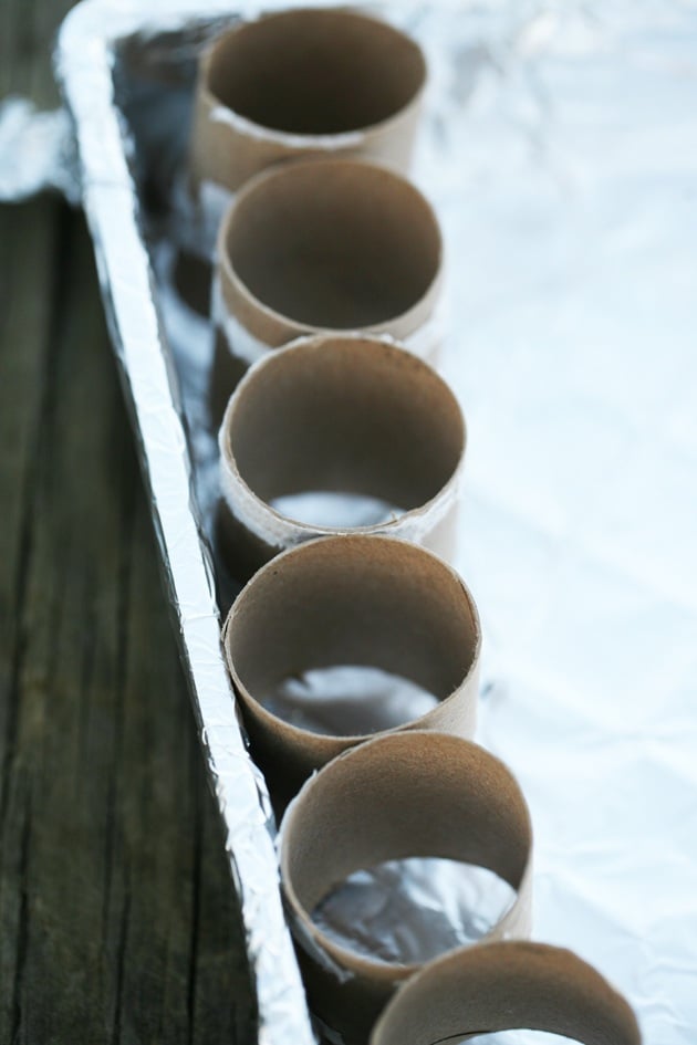 Placing the half rolls in a tray.