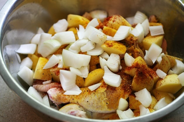 Super easy roasted chicken with potatoes and onions. It takes just a couple of minutes to put this together! 