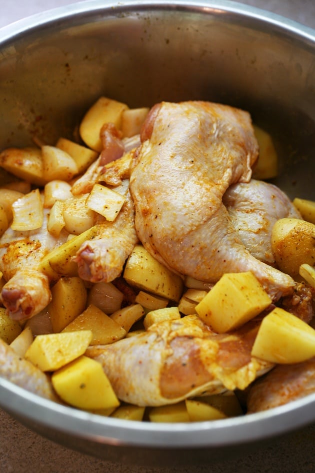 Super easy roasted chicken with potatoes and onions. It takes just a couple of minutes to put this together! 