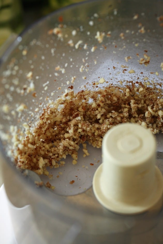 Garlic and almonds processed for pesto