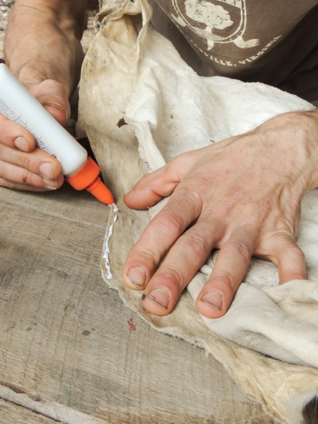 Gluing the two hides together before smoking. 