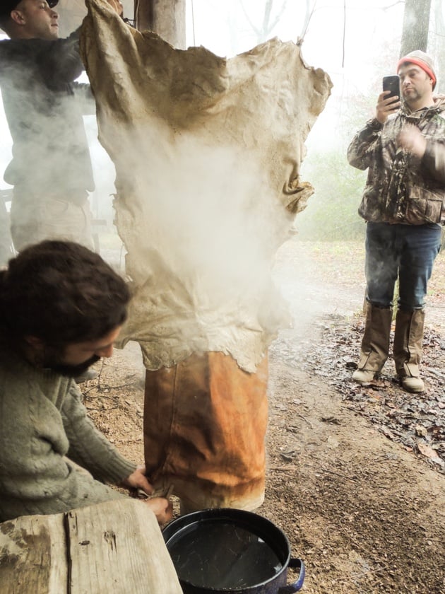 Fitting the skirt over the smoking bucket. 