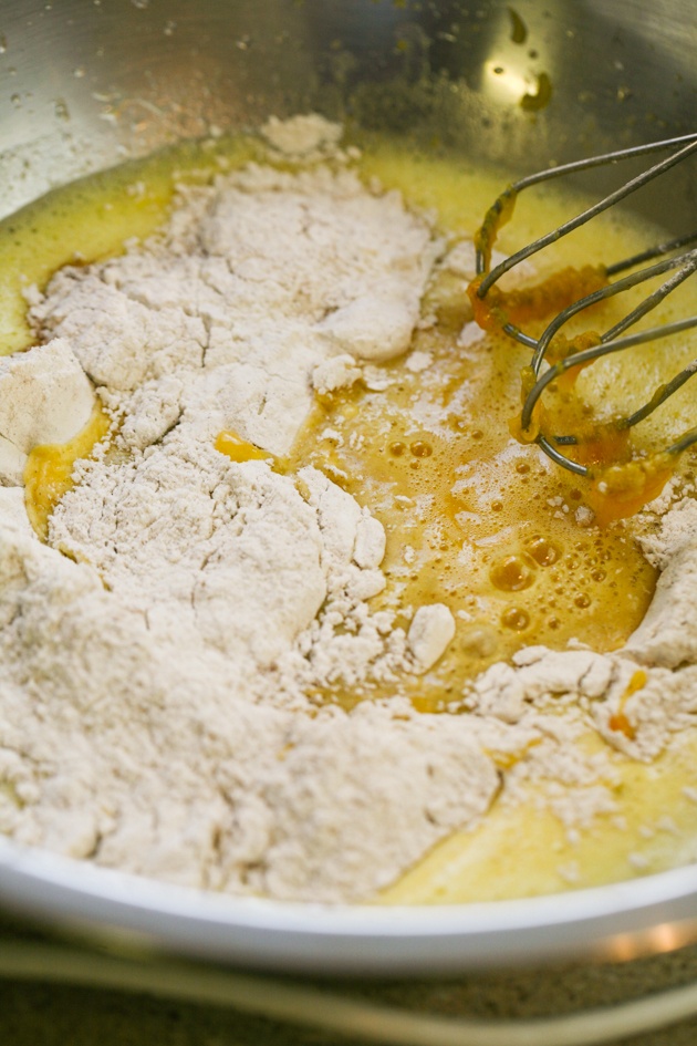 Mixing wet and dry ingredients.
