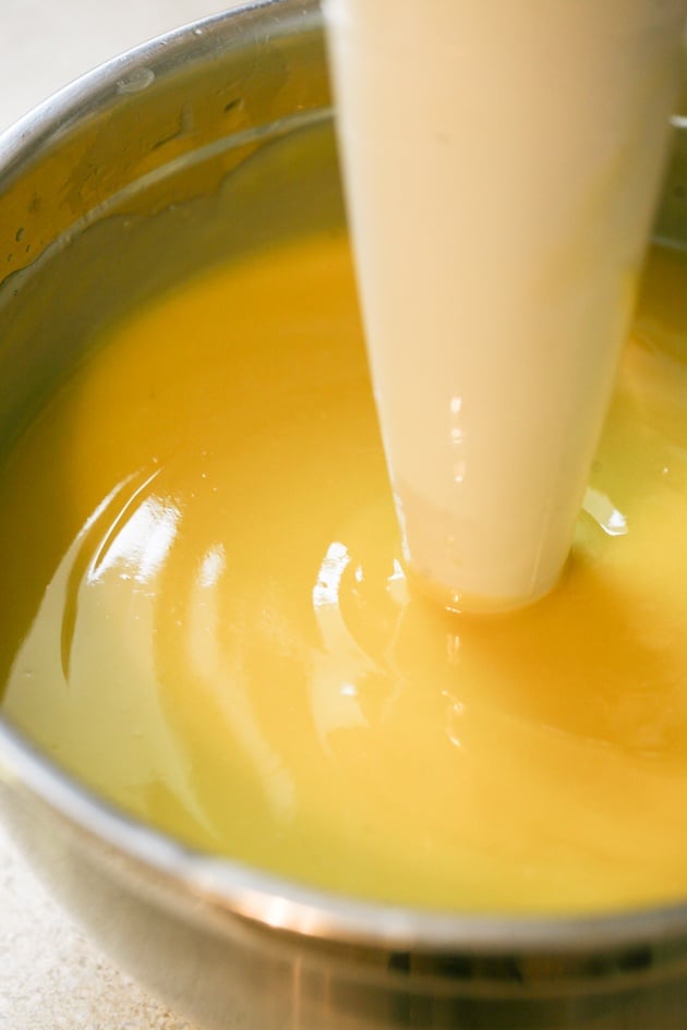 Using immersion blender to mix soap batter. 