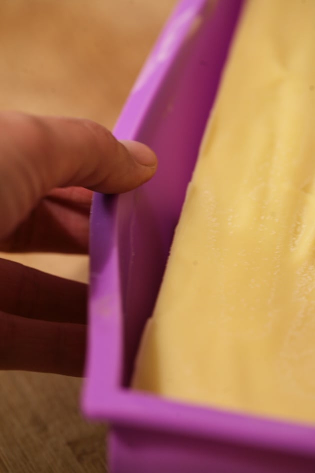 Releasing the soap from the mold.