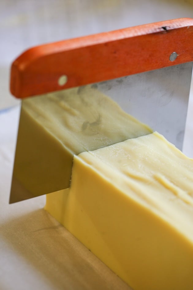 Cutting the bar os soap.