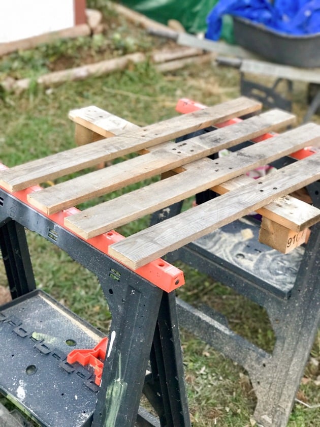 Breaking apart the wooden pallets.