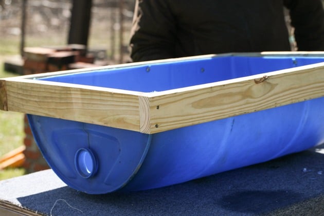 DIY top bar hive from a barrel. A step by step picture tutorial on how we made our top bar bee hive. It is a fairly easy project and very inexpensive. Can be completed in just a few hours. 