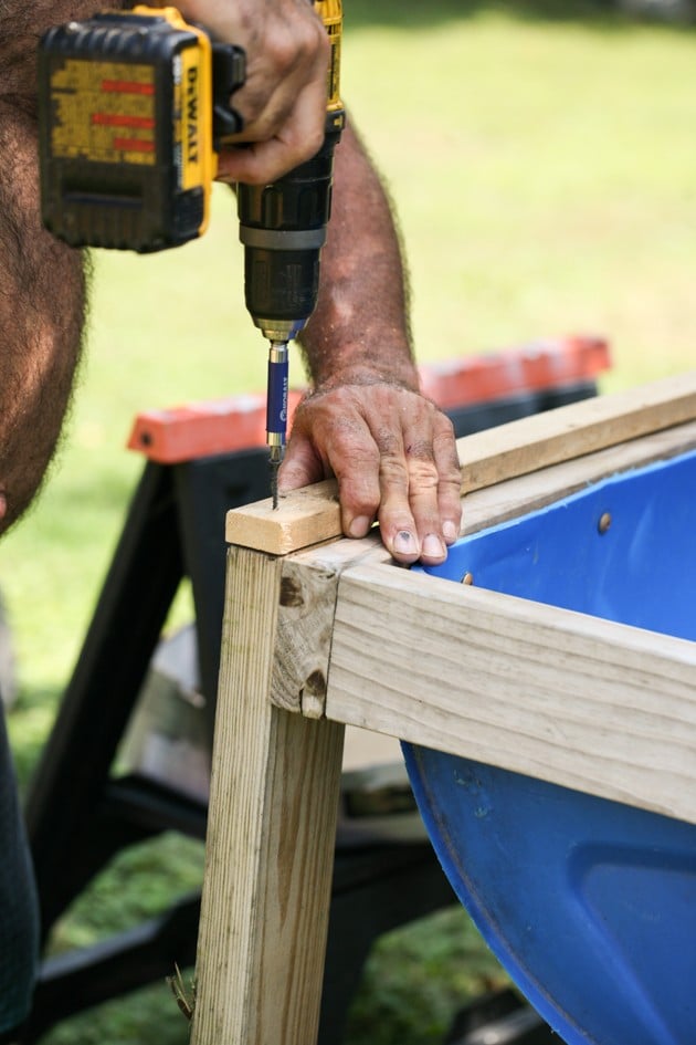 DIY top bar hive from a barrel. A step by step picture tutorial on how we made our top bar bee hive. It is a fairly easy project and very inexpensive. Can be completed in just a few hours. 