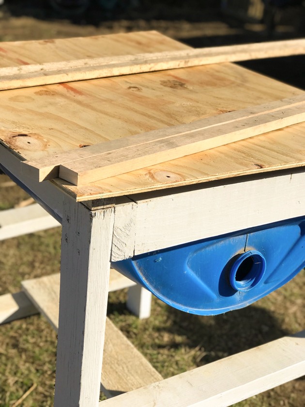 DIY top bar hive from a barrel. A step by step picture tutorial on how we made our top bar bee hive. It is a fairly easy project and very inexpensive. Can be completed in just a few hours. 