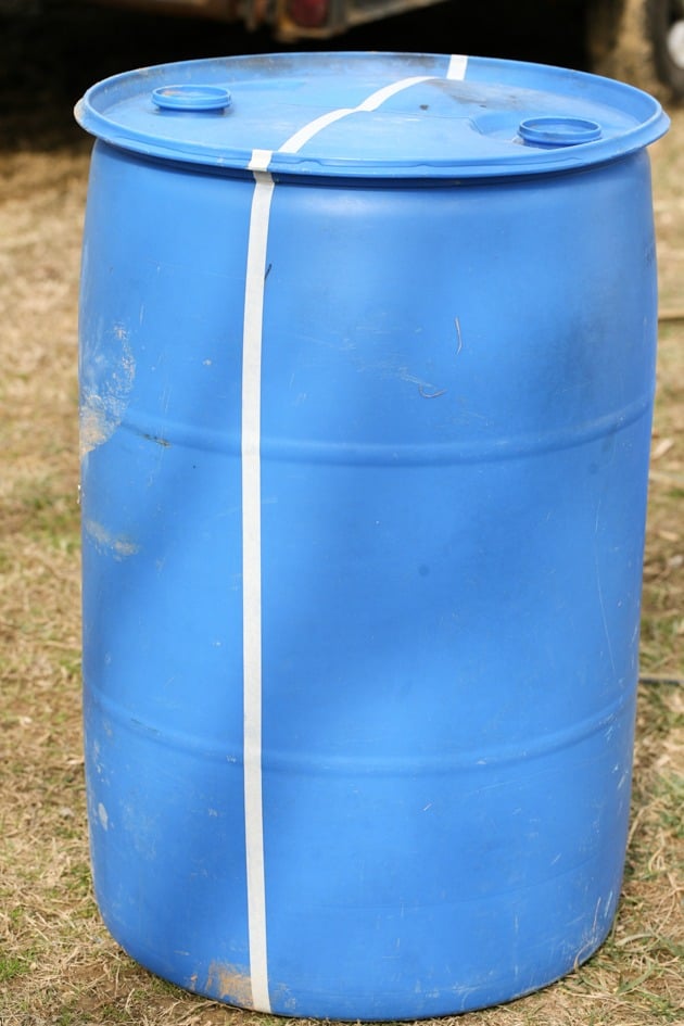 DIY top bar hive from a barrel. A step by step picture tutorial on how we made our top bar bee hive. It is a fairly easy project and very inexpensive. Can be completed in just a few hours. 