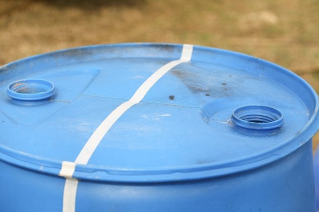 DIY top bar hive from a barrel. A step by step picture tutorial on how we made our top bar bee hive. It is a fairly easy project and very inexpensive. Can be completed in just a few hours. 