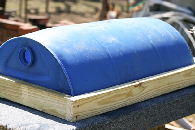 DIY top bar hive from a barrel. A step by step picture tutorial on how we made our top bar bee hive. It is a fairly easy project and very inexpensive. Can be completed in just a few hours. 