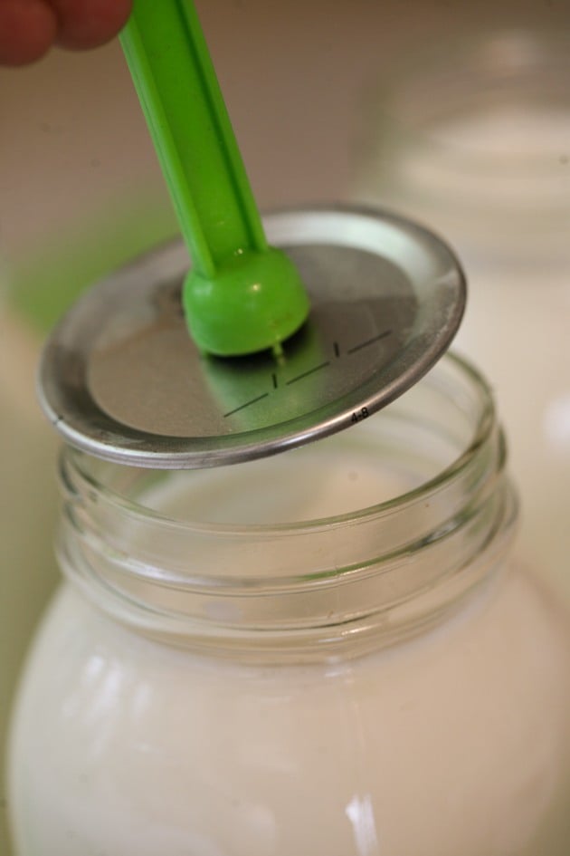 Covering the jar with a lid.