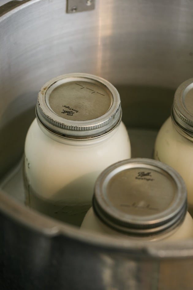 Placing the jars in the canner.