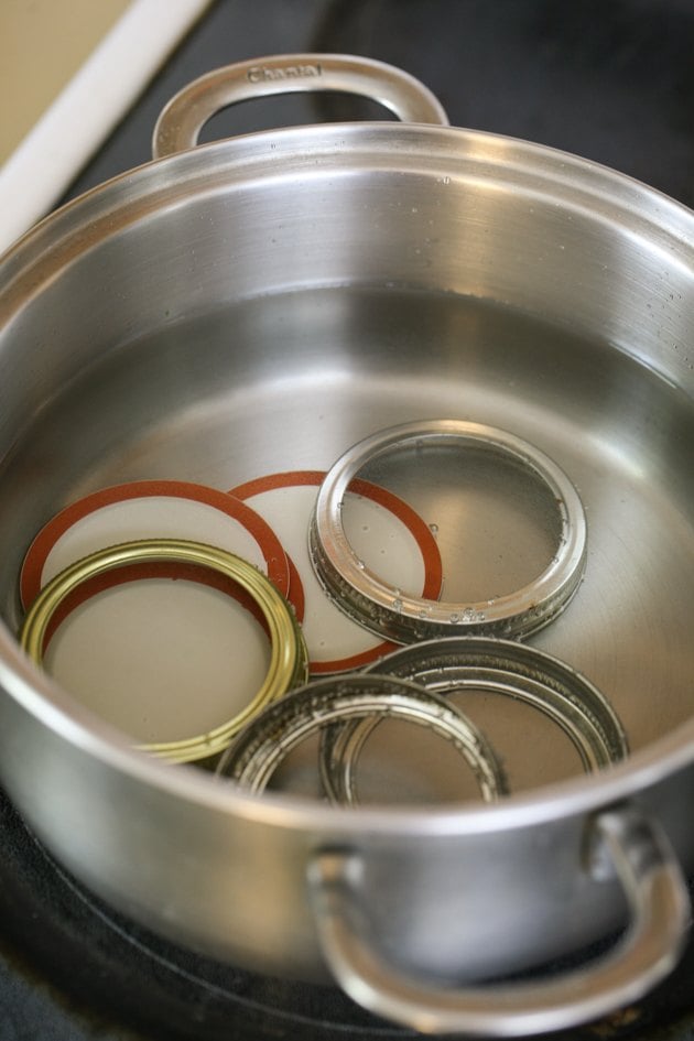 Sanitizing the lids and rings.