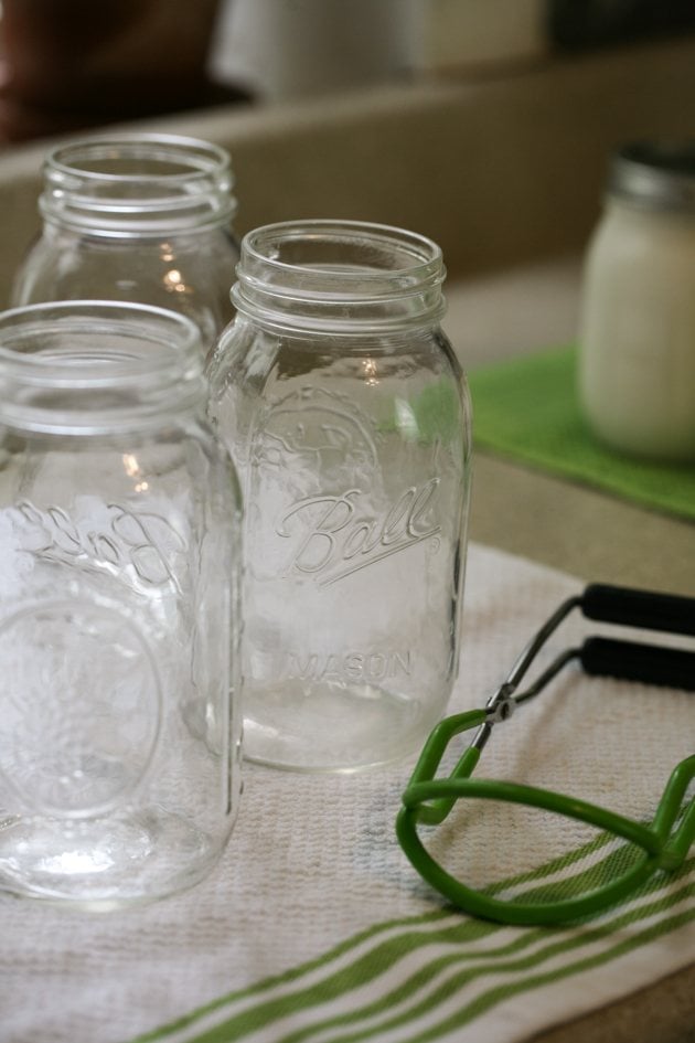 Removing the jars from the oven.