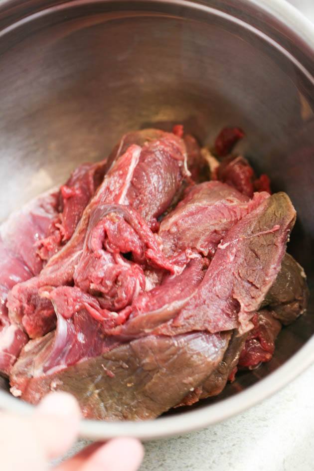 Pulled venison recipe. I used it in a wrap with a delicious red cabbage salad but it can also be a main dish along with a side of rice, mash potatoes, quinoa or anything else you like. The meat is soft and the sauce is delicious! #venison #venisonrecipes #howtocookvenison #deermeat #hunting #hunterfood #deermeatrecipes #huntingseason