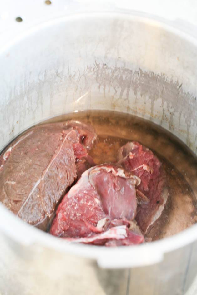 Pulled venison recipe. I used it in a wrap with a delicious red cabbage salad but it can also be a main dish along with a side of rice, mash potatoes, quinoa or anything else you like. The meat is soft and the sauce is delicious! #venison #venisonrecipes #howtocookvenison #deermeat #hunting #hunterfood #deermeatrecipes #huntingseason