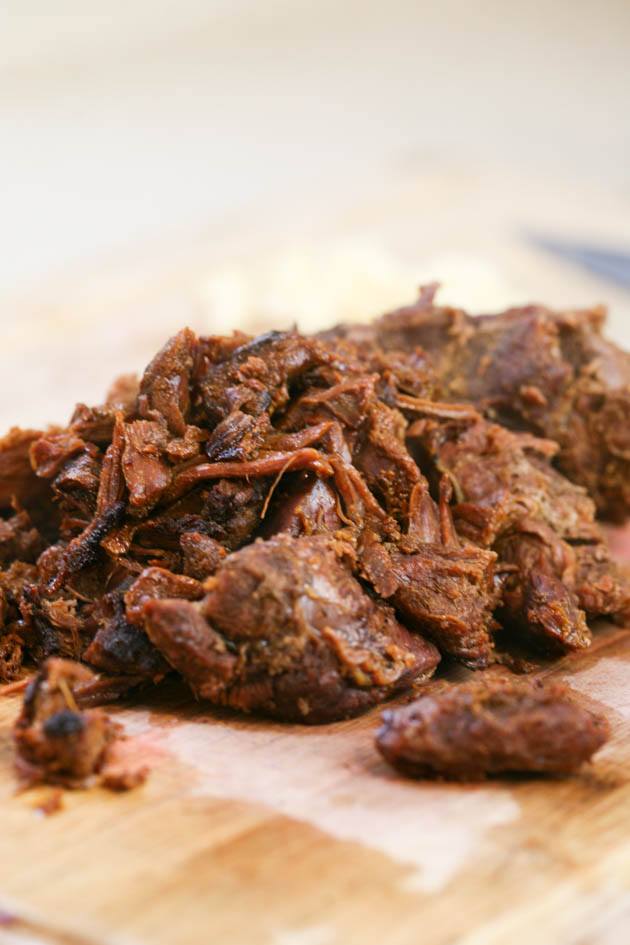 Pulled venison recipe. I used it in a wrap with a delicious red cabbage salad but it can also be a main dish along with a side of rice, mash potatoes, quinoa or anything else you like. The meat is soft and the sauce is delicious! #venison #venisonrecipes #howtocookvenison #deermeat #hunting #hunterfood #deermeatrecipes #huntingseason