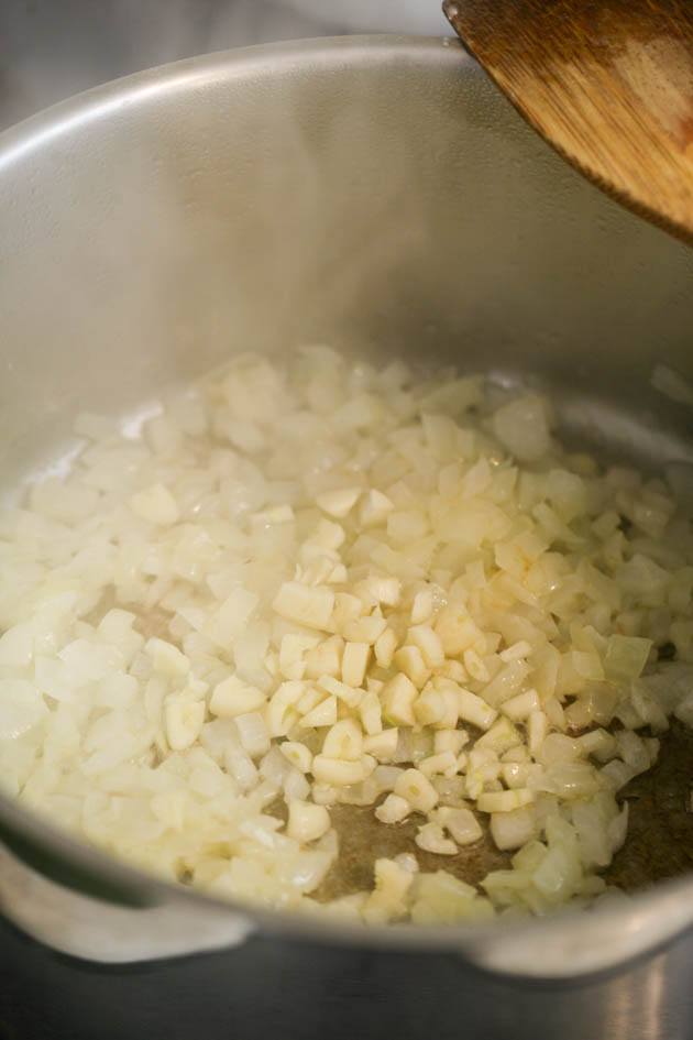 Adding garlic to the diced onions.