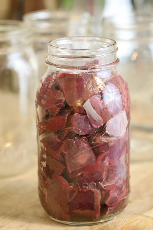 Packing the jar with meat