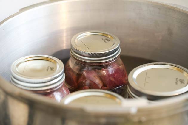 Jars of meat in the pressure canner