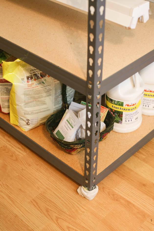 Adding socks on the bottom of each leg of the shelving unit. 