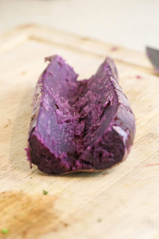 Slicing the baked purple sweet potato. 