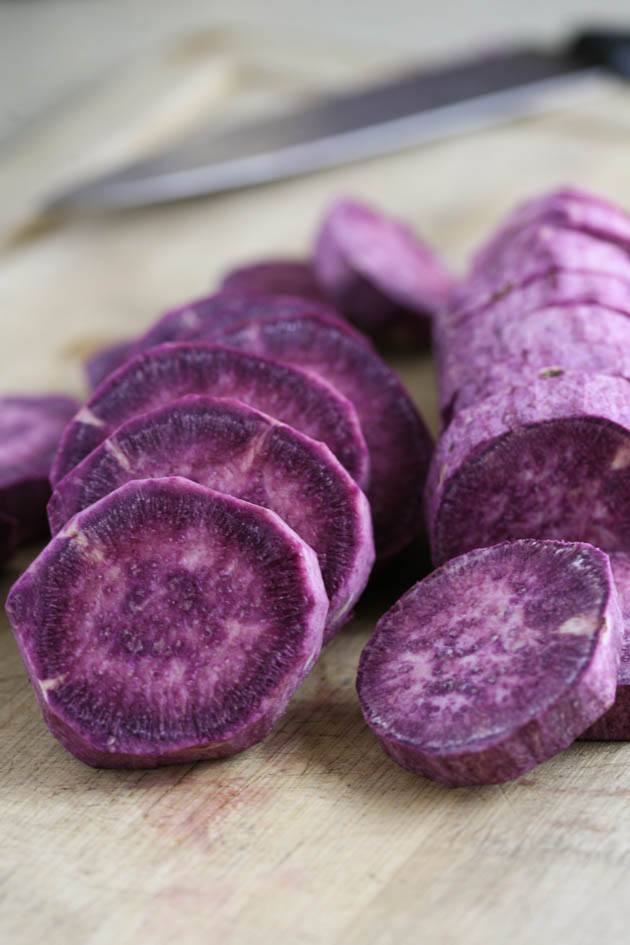 Sliced roasted purple sweet potatoes.
