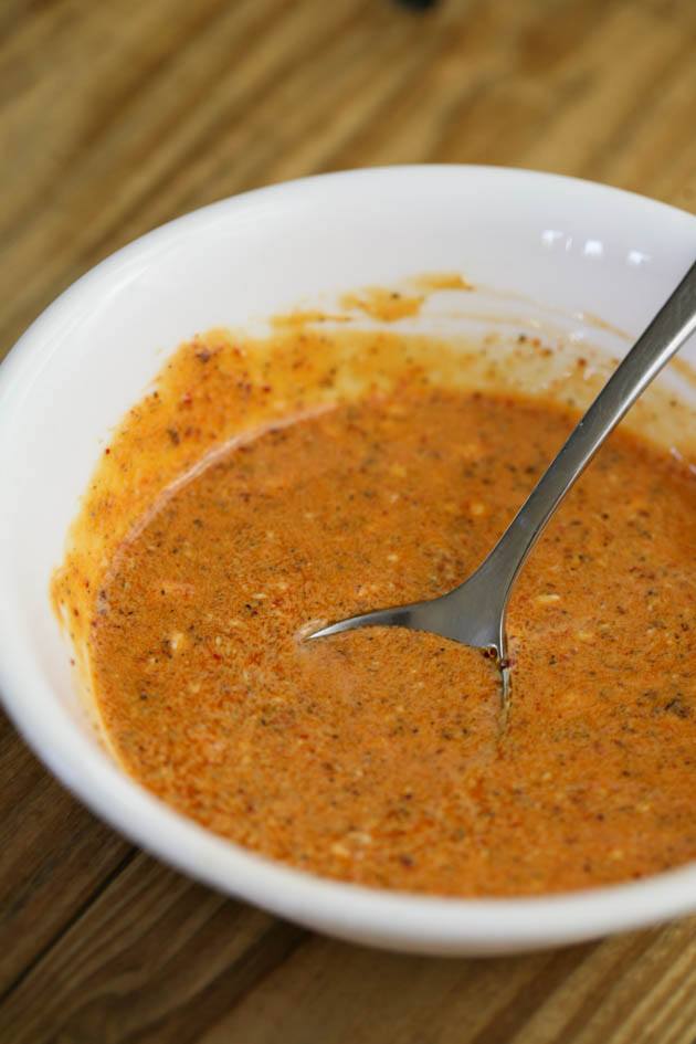 Mixing the sauce ingredients.