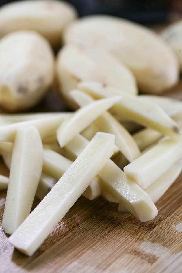 Potatoes cut for french fries before blanching