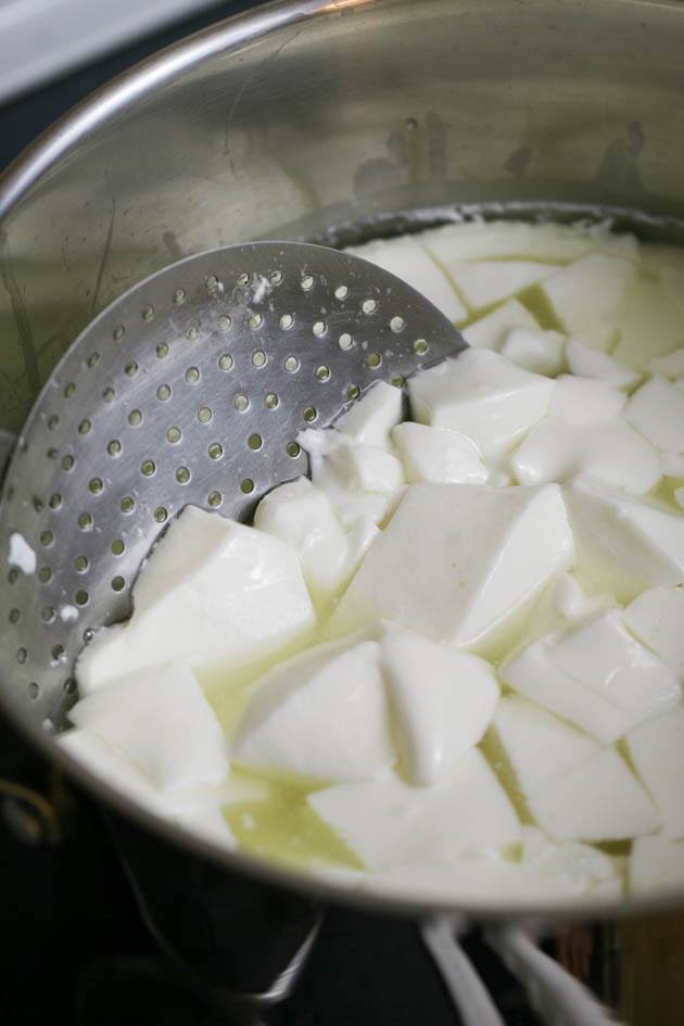 Stirring the curds. 