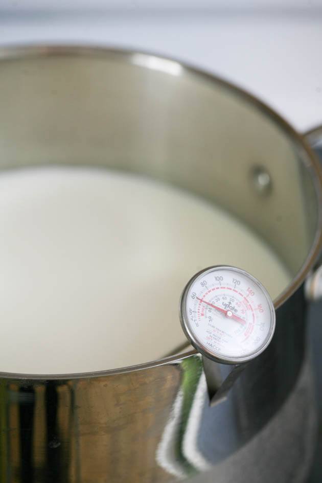 Heating the milk. 
