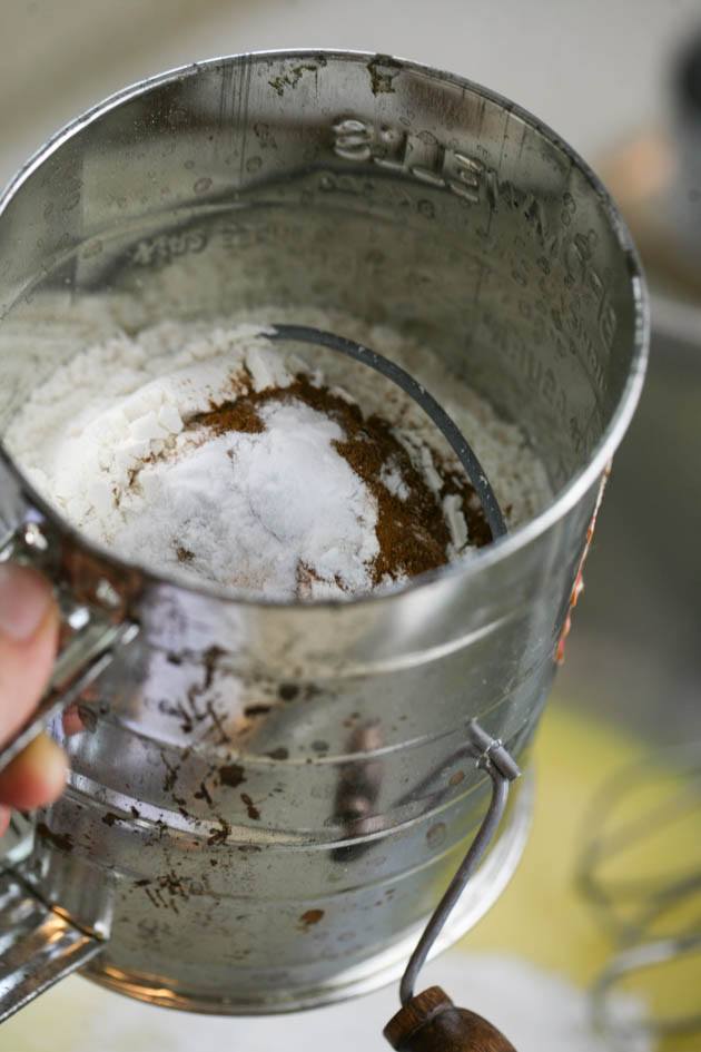 sifting dry ingredients over the wet ingredients