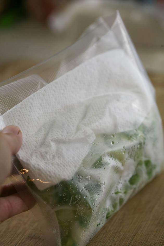 Insert a paper towel before vacuuming the bag of leeks