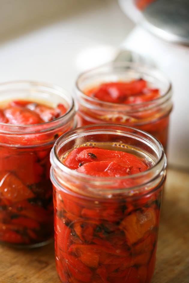 Packing the jars with roasted peppers.