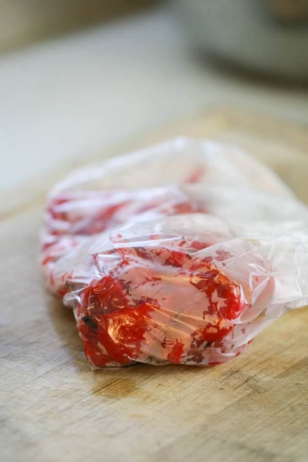Roasted peppers in a plastic bag.