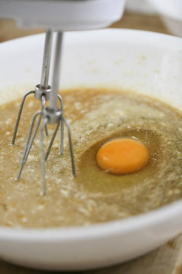 Adding eggs to wet ingredients.