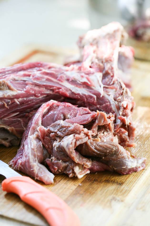 Cutting the meat from a venison neck.