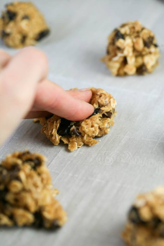 Forming the simple oatmeal cookies.