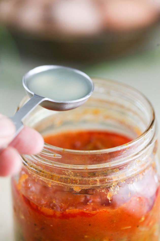 Adding one tablespoon of lemon juice to the jar of stewed tomatoes. 